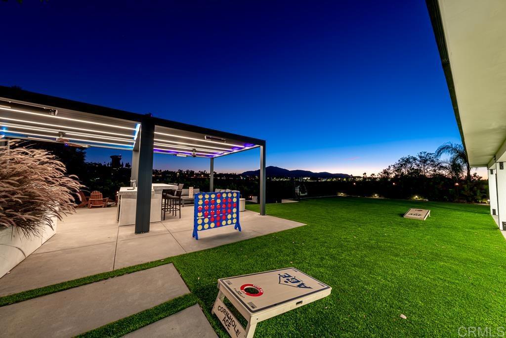1286 Rippey Street El Cajon, CA 92020 - Photo 72 of 74 a view of a chairs and table in patio with a yard
