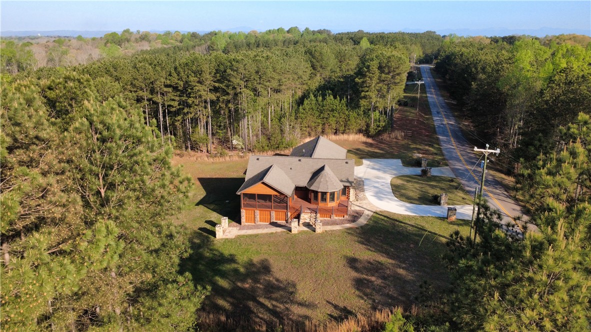128 McAlister Road West Union, SC 29696 - Photo 40 of 40 Nestled among towering pines, this secluded residence offers an idyllic escape with its charming architecture and sweeping natural views.