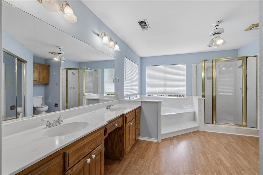 290 Sycamore Street Van, TX 75790 - Photo 22 of 38 a large bathroom with a large mirror vanity and a sink