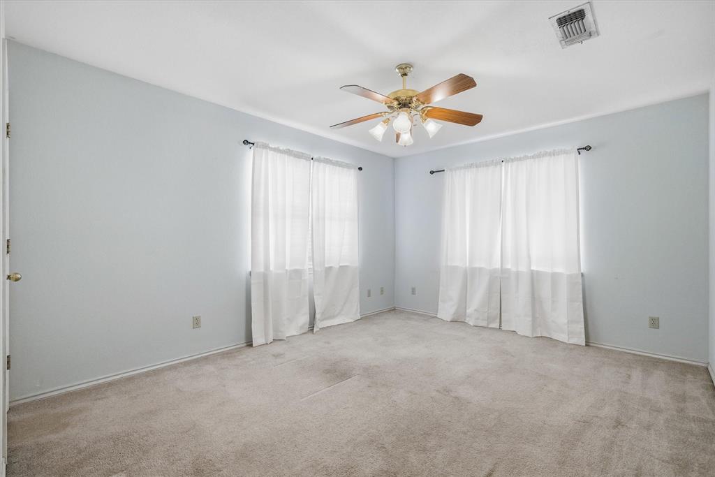 290 Sycamore Street Van, TX 75790 - Photo 25 of 38 an empty room with windows and fan