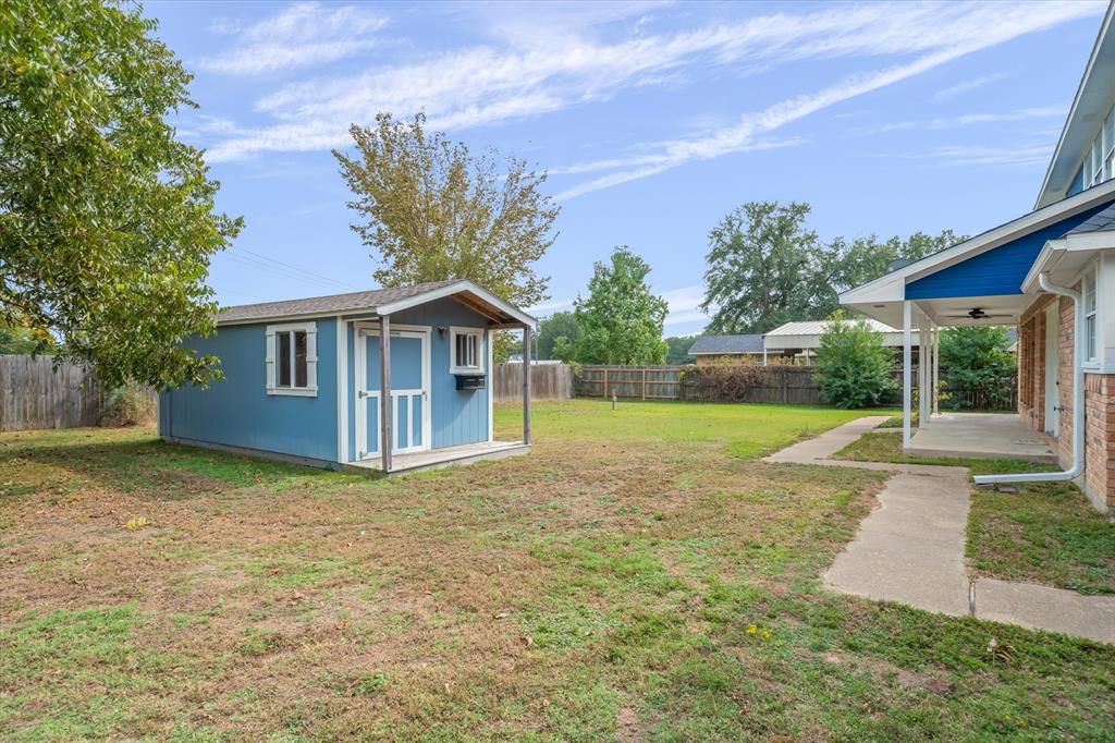 290 Sycamore Street Van, TX 75790 - Photo 33 of 38 a view of backyard of house with green space