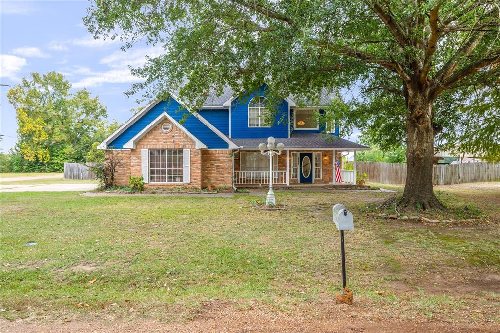 290 Sycamore Street Van, TX 75790 - Photo 35 of 38 a front view of a house with a yard