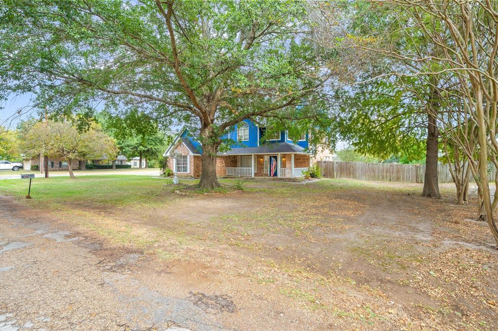 290 Sycamore Street Van, TX 75790 - Photo 36 of 38 a front view of a house with a yard