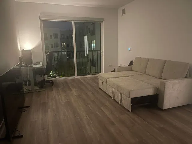 a bedroom with a bed and lamp with window