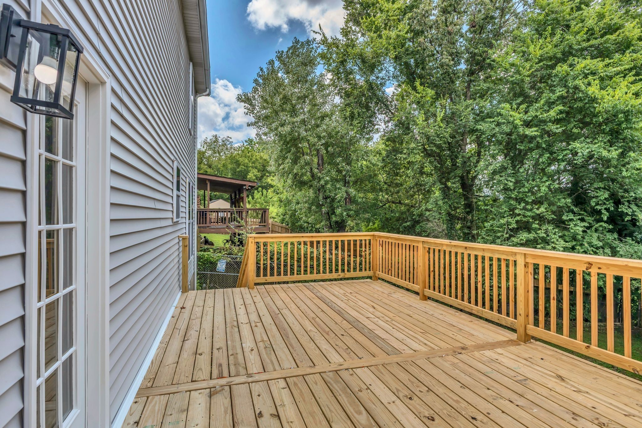 408 Hampstead South Antioch, TN 37013 - Photo 31 of 34 a balcony with wooden floor and fence