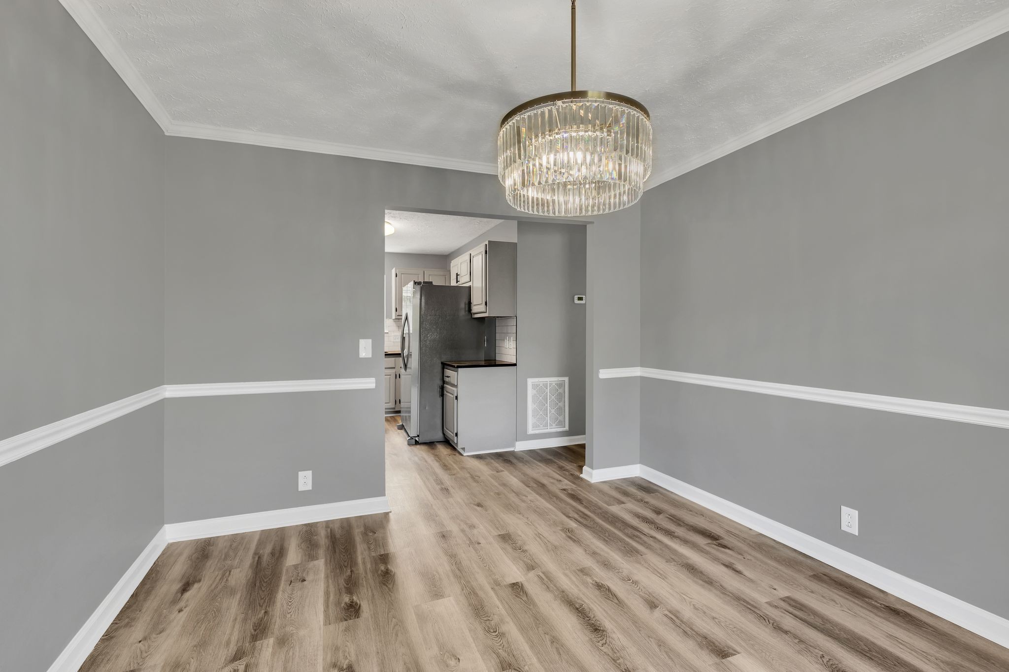 408 Hampstead South Antioch, TN 37013 - Photo 9 of 34 a view of a room with wooden floor fridge and window