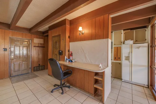 a kitchen with a sink cabinets and window