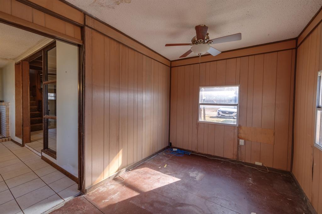 5 Angels Breath Road Abilene, TX 79601 - Photo 23 of 40 a view of a hallway with a glass door and chandelier fan