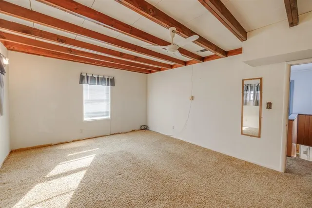 a bathroom with a granite countertop sink a mirror and a shower