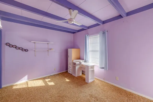 a bathroom with a sink mirror vanity and toilet