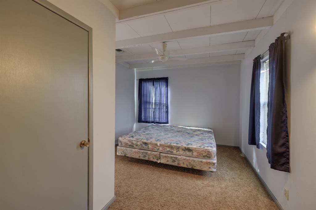 5 Angels Breath Road Abilene, TX 79601 - Photo 35 of 40 a spacious bedroom with a bed and a dresser
