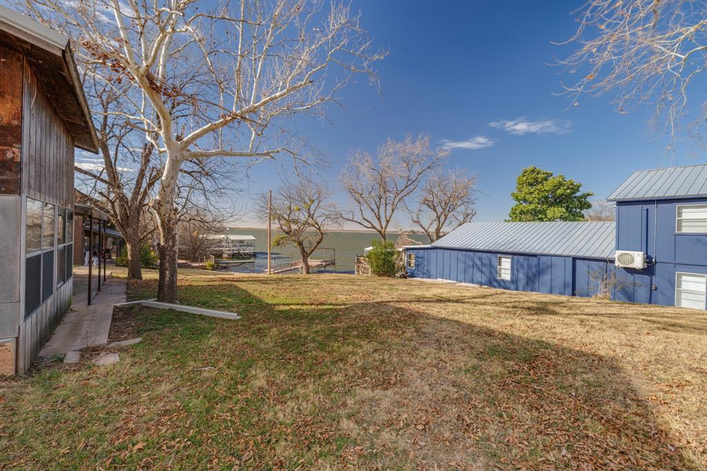 5 Angels Breath Road Abilene, TX 79601 - Photo 38 of 40 a view of a yard with a house and a large tree