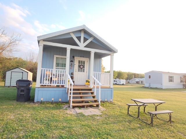 370 Sioux Quitman, TX 75783 - Photo 1 of 34 a view of a house with lounge chairs in a patio
