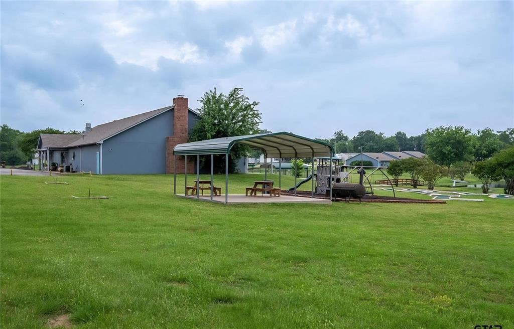 370 Sioux Quitman, TX 75783 - Photo 28 of 34 a front view of house with yard and seating