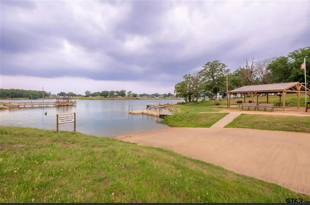 370 Sioux Quitman, TX 75783 - Photo 29 of 34 a view of a lake with houses in the background