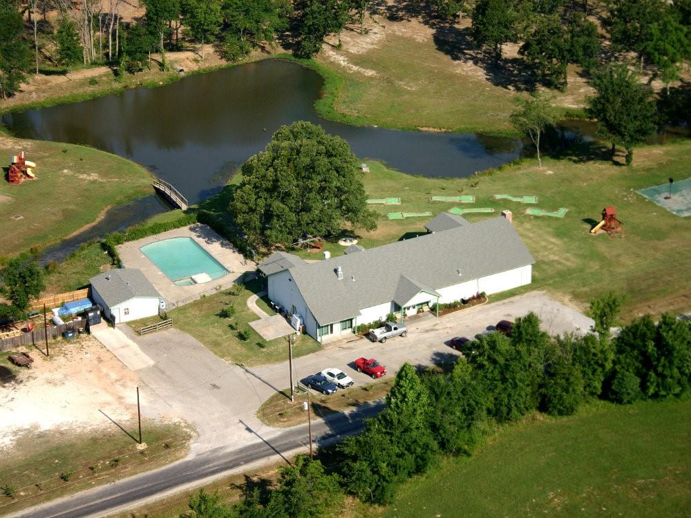 370 Sioux Quitman, TX 75783 - Photo 8 of 34 an aerial view of residential houses with outdoor space