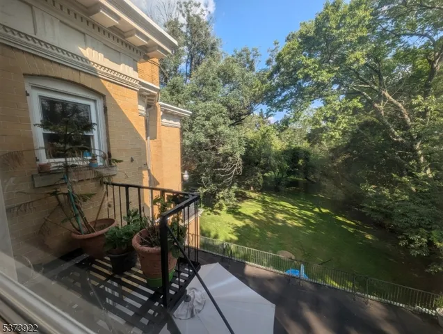 a view of balcony with wooden floor