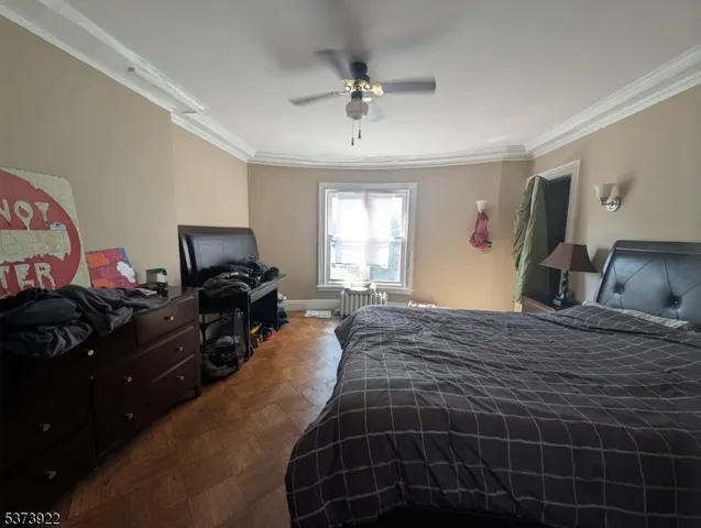 a bed room with a bed and dresser