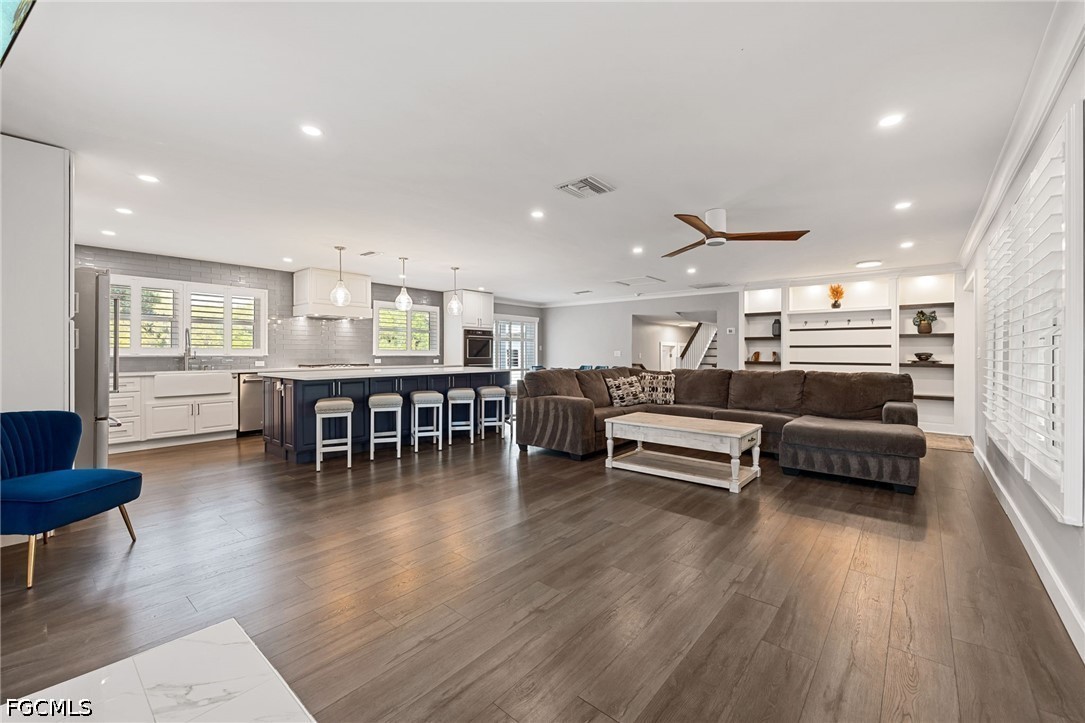 4220 Staley Road Fort Myers, FL 33905 - Photo 12 of 47 a living room with furniture and a wooden floor
