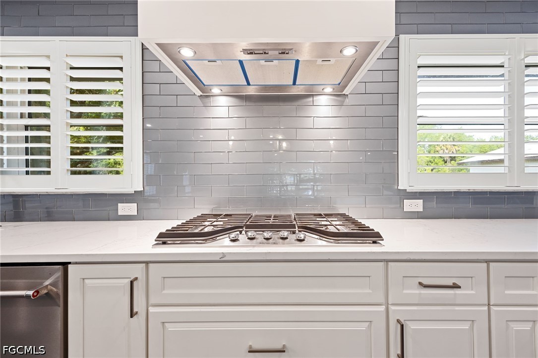 4220 Staley Road Fort Myers, FL 33905 - Photo 16 of 47 a kitchen with a stove and a window