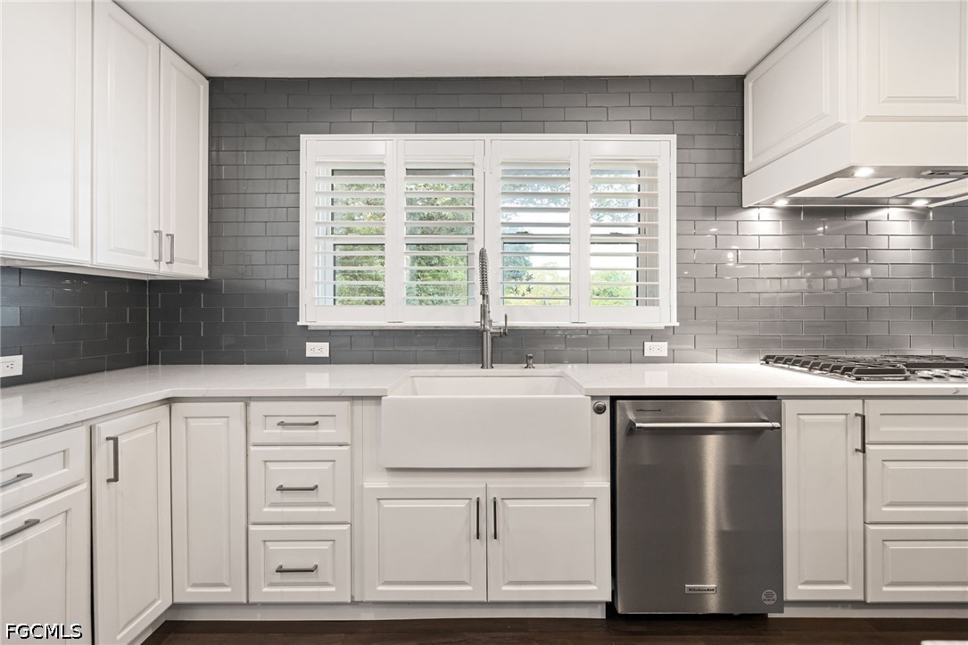 4220 Staley Road Fort Myers, FL 33905 - Photo 17 of 47 a kitchen with granite countertop white cabinets and white appliances
