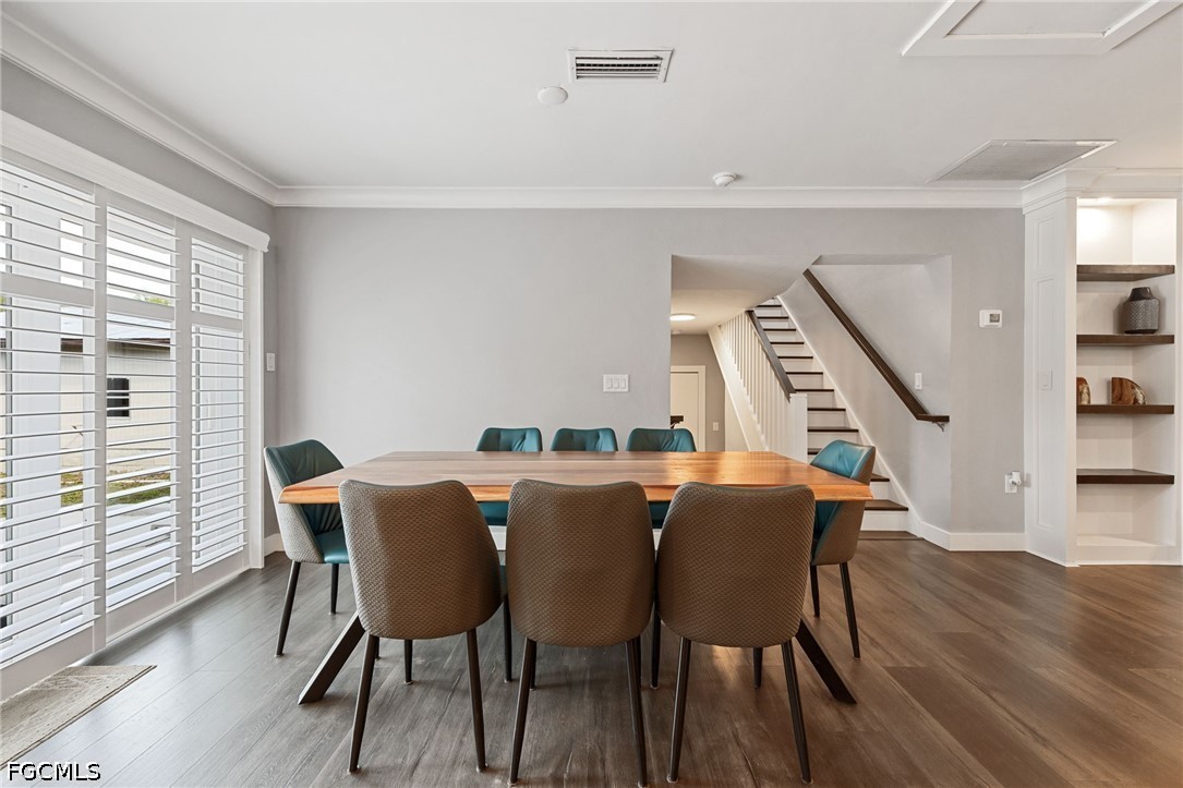 4220 Staley Road Fort Myers, FL 33905 - Photo 18 of 47 a view of a dining room with furniture and wooden floor