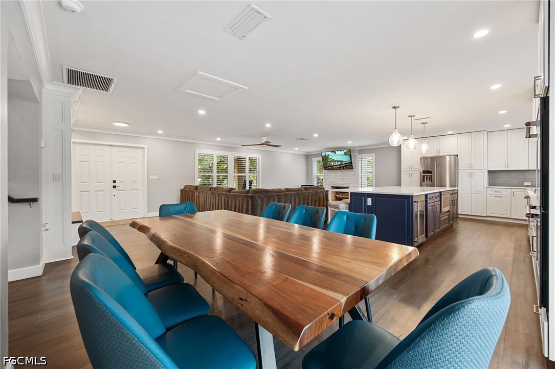 4220 Staley Road Fort Myers, FL 33905 - Photo 19 of 47 a large dining space with furniture and a wooden floor
