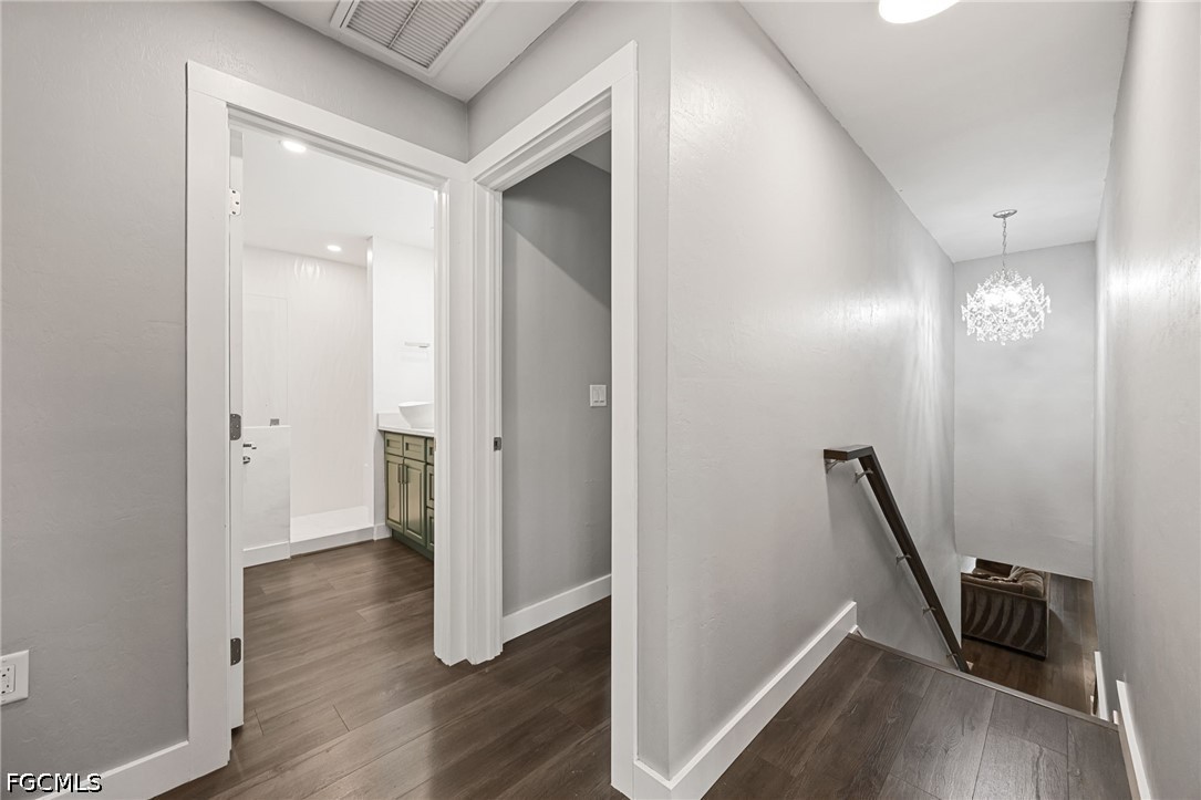4220 Staley Road Fort Myers, FL 33905 - Photo 20 of 47 a view of a hallway with wooden floor and staircase