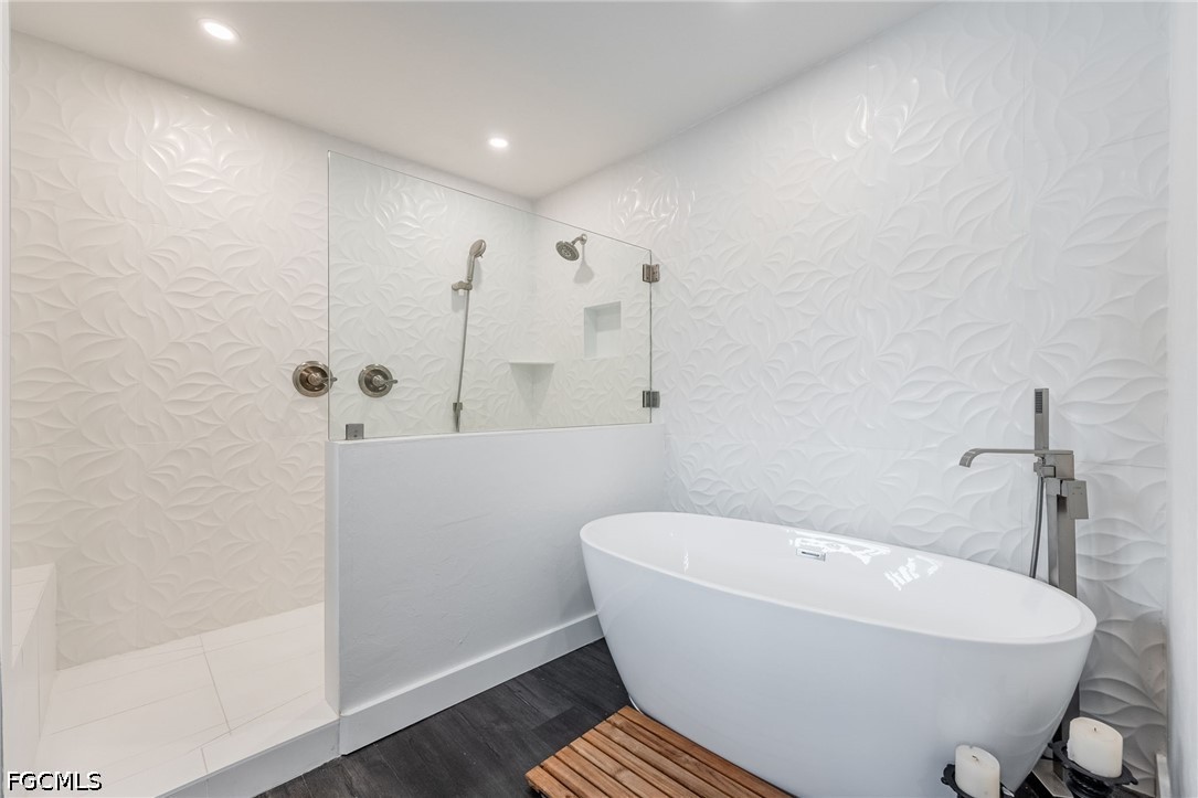 4220 Staley Road Fort Myers, FL 33905 - Photo 24 of 47 a white bath tub sitting in a bathroom