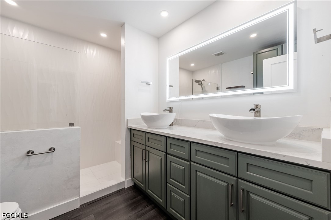 4220 Staley Road Fort Myers, FL 33905 - Photo 27 of 47 a bathroom with a sink a mirror and a shower