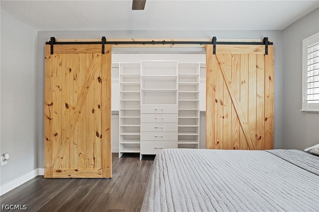 4220 Staley Road Fort Myers, FL 33905 - Photo 30 of 47 a view of a bedroom with wooden floor and closet