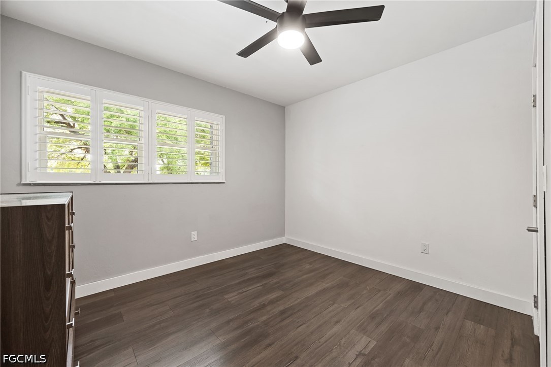 4220 Staley Road Fort Myers, FL 33905 - Photo 31 of 47 an empty room with wooden floor and windows