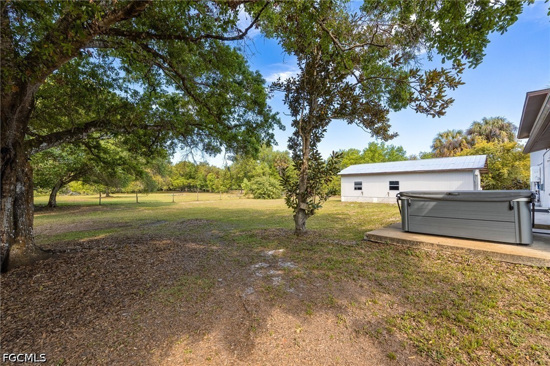 4220 Staley Road Fort Myers, FL 33905 - Photo 34 of 47 a view of backyard with tree