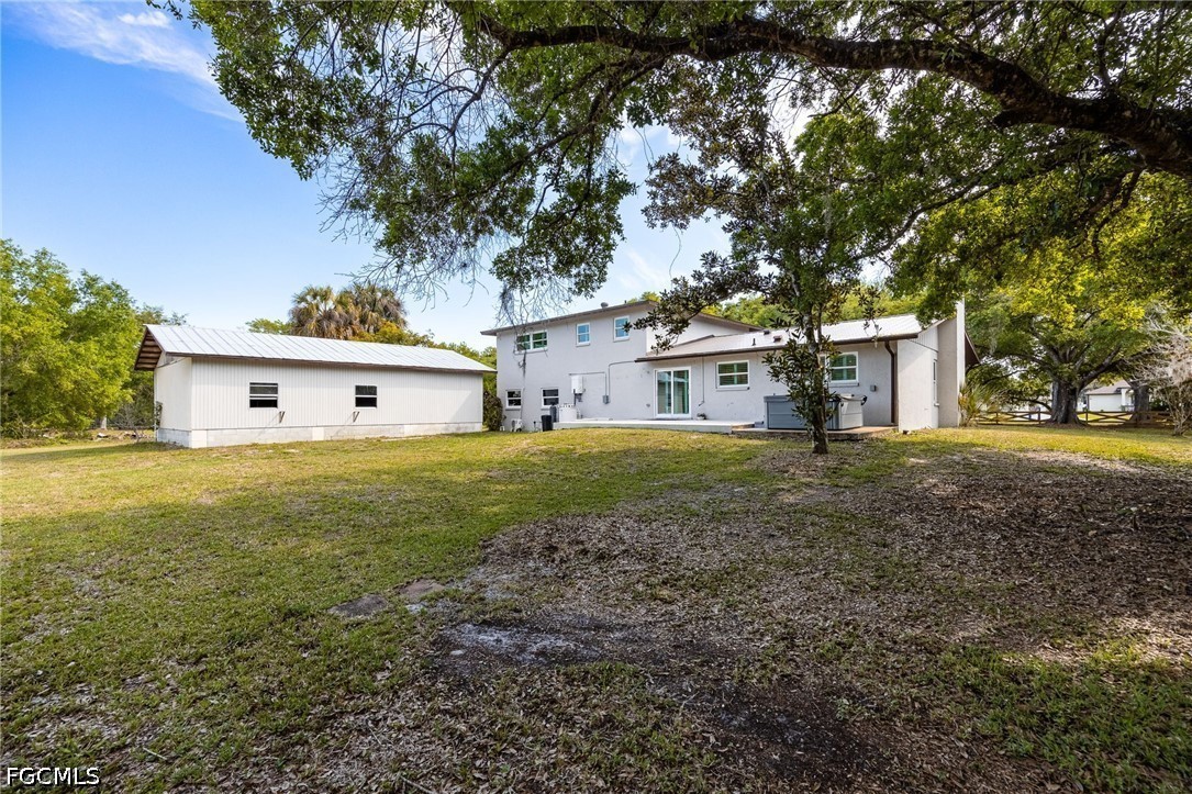 4220 Staley Road Fort Myers, FL 33905 - Photo 35 of 47 a front view of a house with a yard