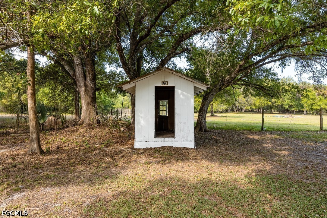 4220 Staley Road Fort Myers, FL 33905 - Photo 40 of 47 a front view of a house with a yard