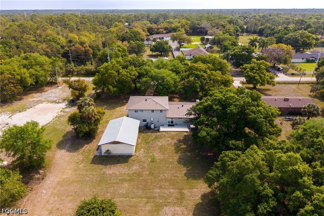 4220 Staley Road Fort Myers, FL 33905 - Photo 42 of 47 an aerial view of a house with yard and mountain view in back