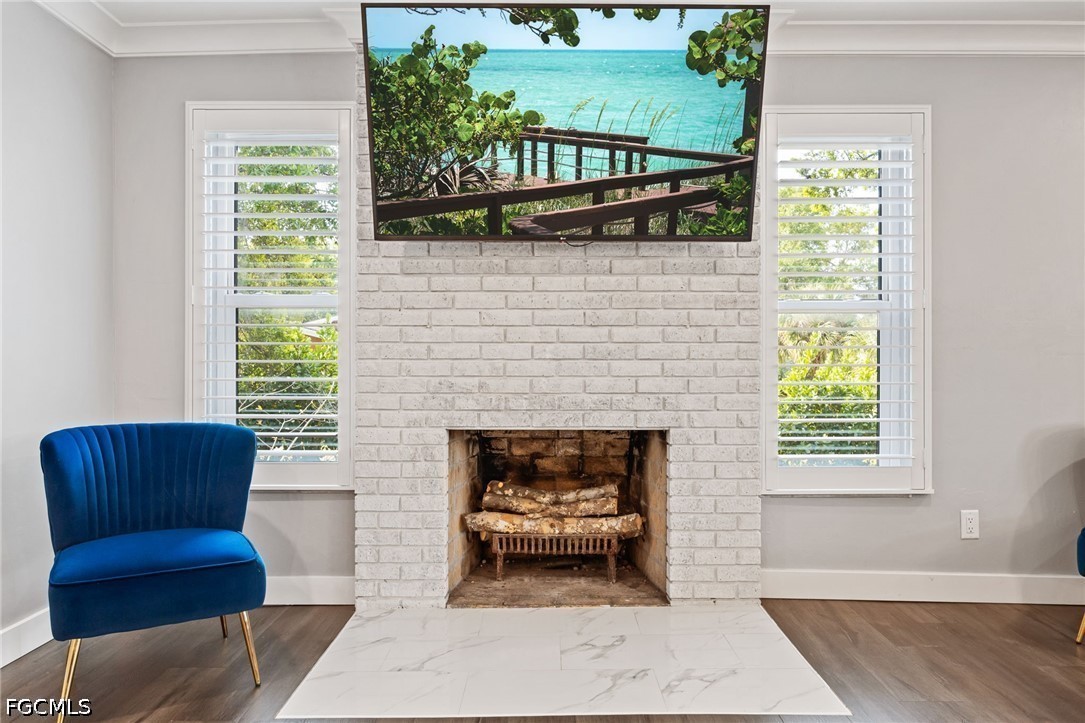 4220 Staley Road Fort Myers, FL 33905 - Photo 10 of 47 a living room with furniture and a fireplace
