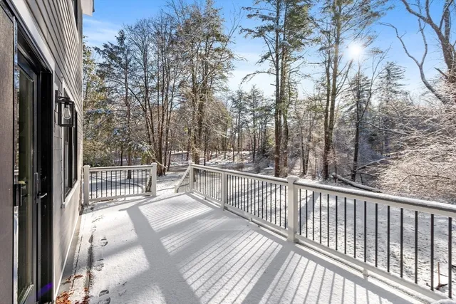 a view of a balcony with wooden floor