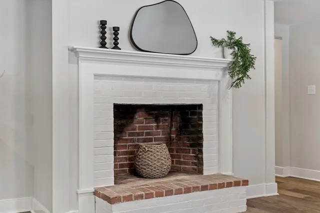 a view of fireplace and wooden floor