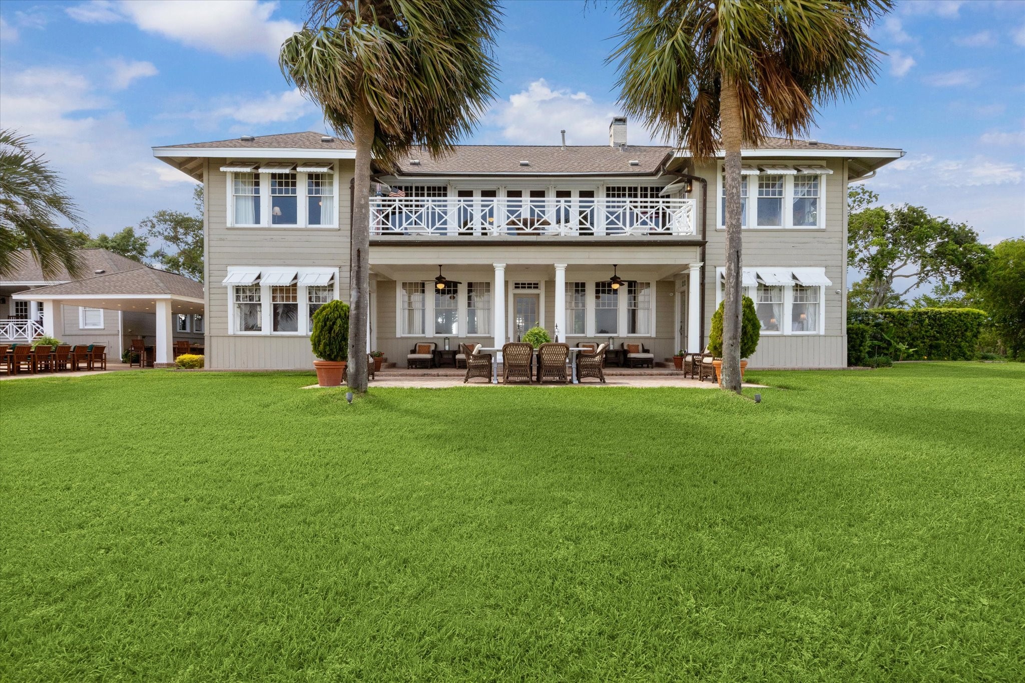 102 South R Street La Porte, TX 77571 - Photo 14 of 43 Bayview side of this historic main residence reveals a second-story balcony, a covered patio, and a serene sitting area-all offering sweeping vistas of Galveston Bay.