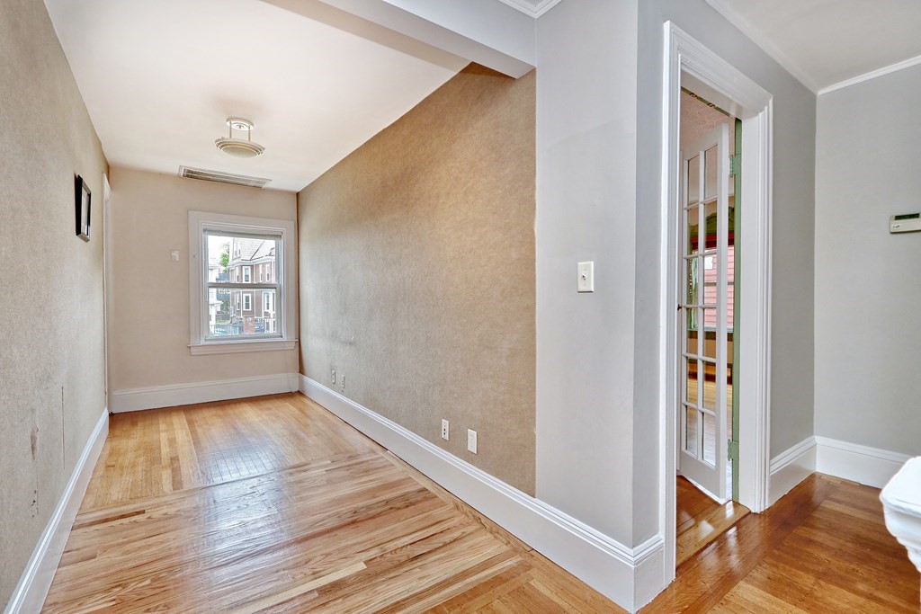 440 Broadway Somerville, MA 02145 - Photo 12 of 27 a view of livingroom with hardwood floor and hallway