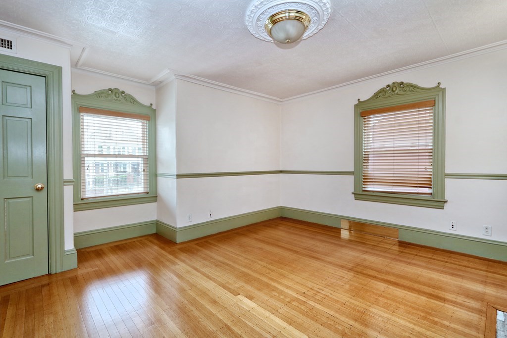 440 Broadway Somerville, MA 02145 - Photo 14 of 27 a view of a livingroom with wooden floor and a window
