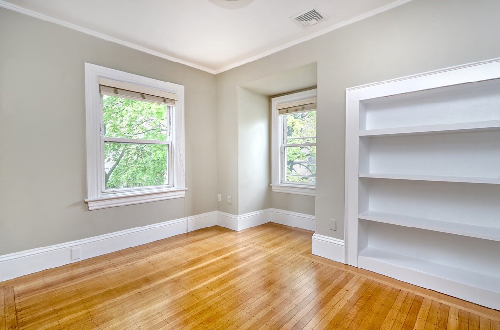 440 Broadway Somerville, MA 02145 - Photo 16 of 27 a view of empty room with wooden floor and fan