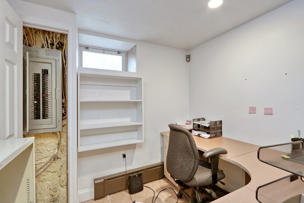 440 Broadway Somerville, MA 02145 - Photo 22 of 27 a room with furniture and wooden floor