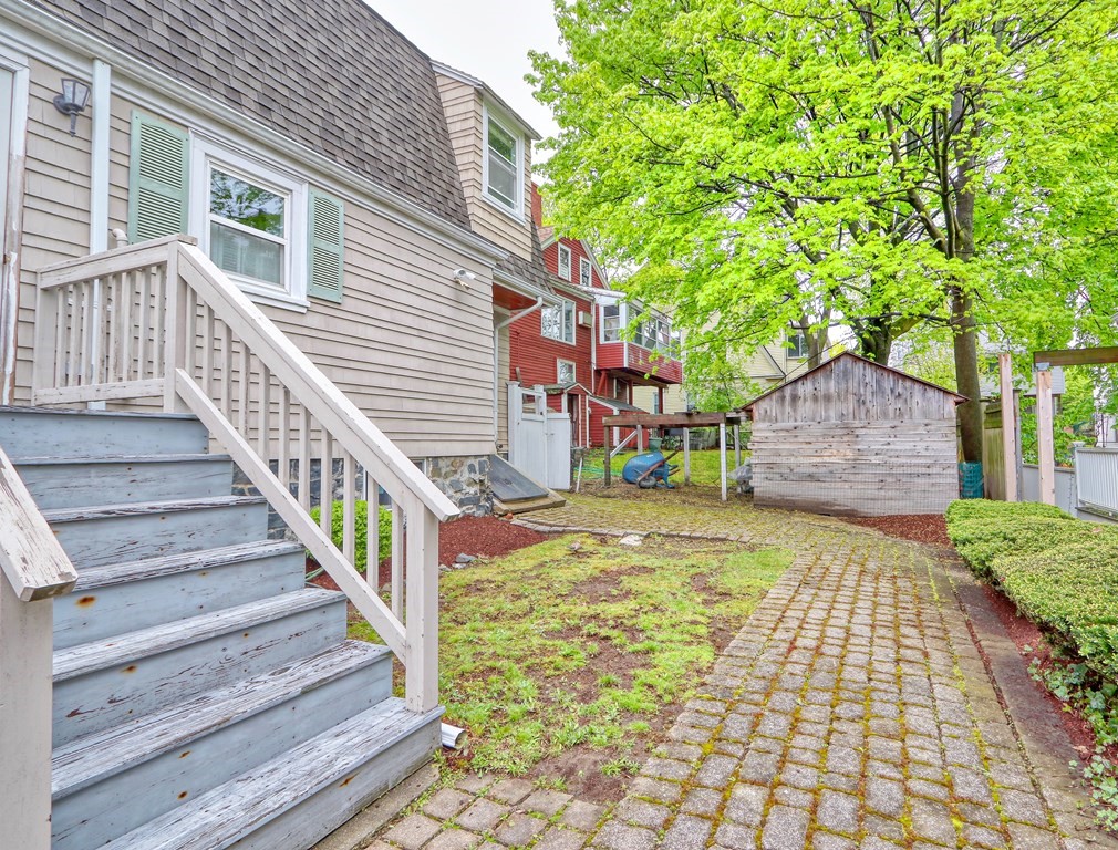 440 Broadway Somerville, MA 02145 - Photo 24 of 27 a view of a house with wooden fence