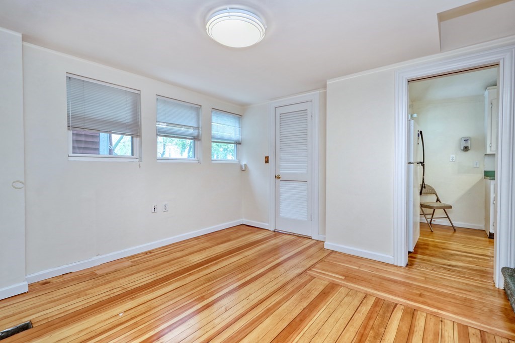 440 Broadway Somerville, MA 02145 - Photo 6 of 27 a view of a room with wooden floor and bathroom