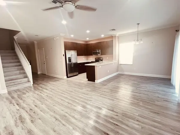 a view of a kitchen with a sink and microwave