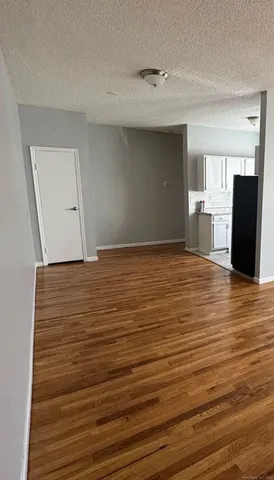 a view of a livingroom with wooden floor
