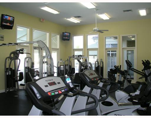 12314 Melrose Way Boca Raton, FL 33428 - Photo 12 of 12 a living room with lots of furniture and gym equipment