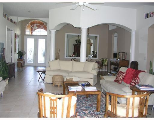 12314 Melrose Way Boca Raton, FL 33428 - Photo 5 of 12 a living room with furniture and a large mirror